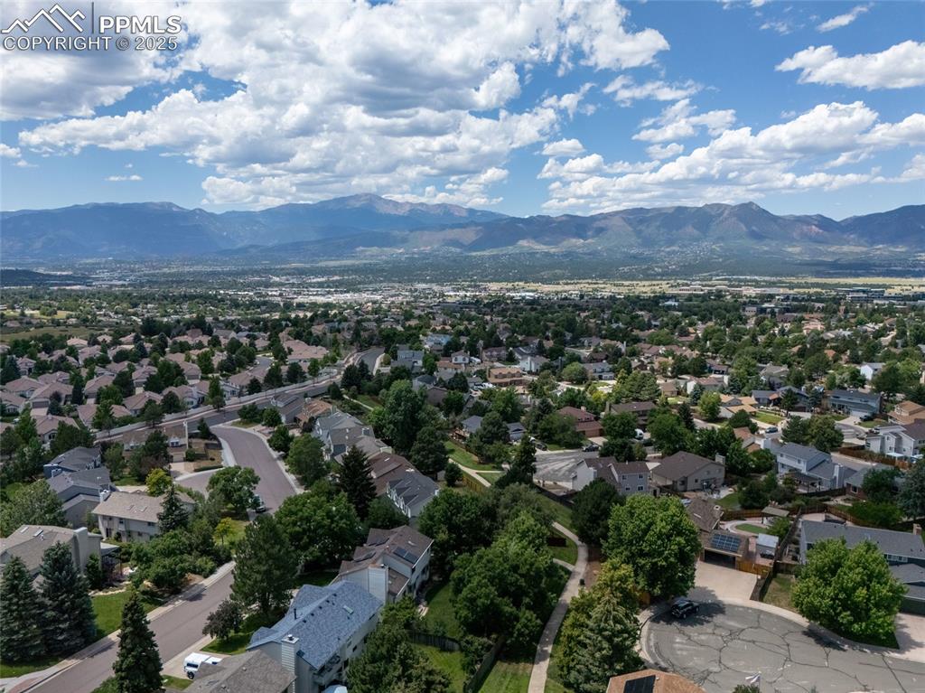 Image 41 of 41: Aerial perspective of suburban area with a mountain backdrop