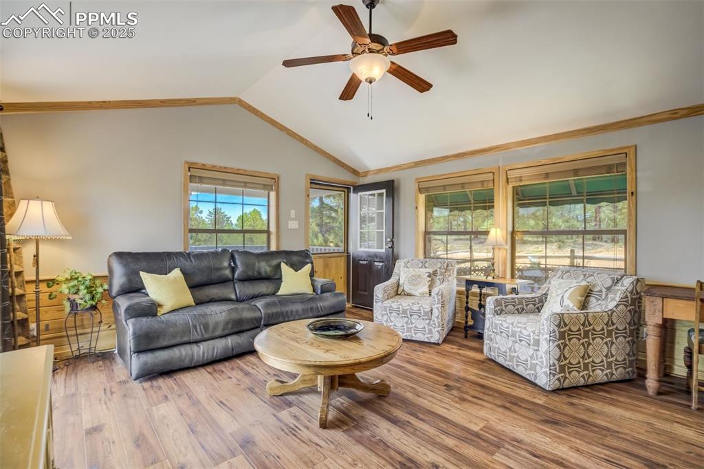Image 8 of 36: Oak coffee table and the two upholstered swivel chairs can stay with the ho