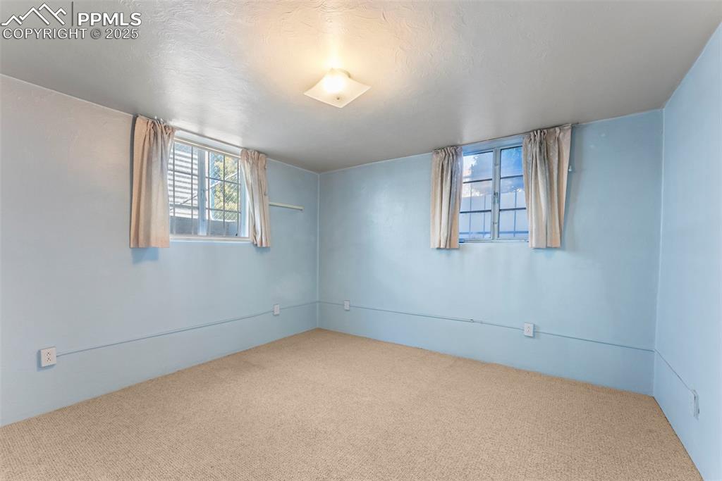Image 21 of 30: Carpeted spare room featuring a textured ceiling