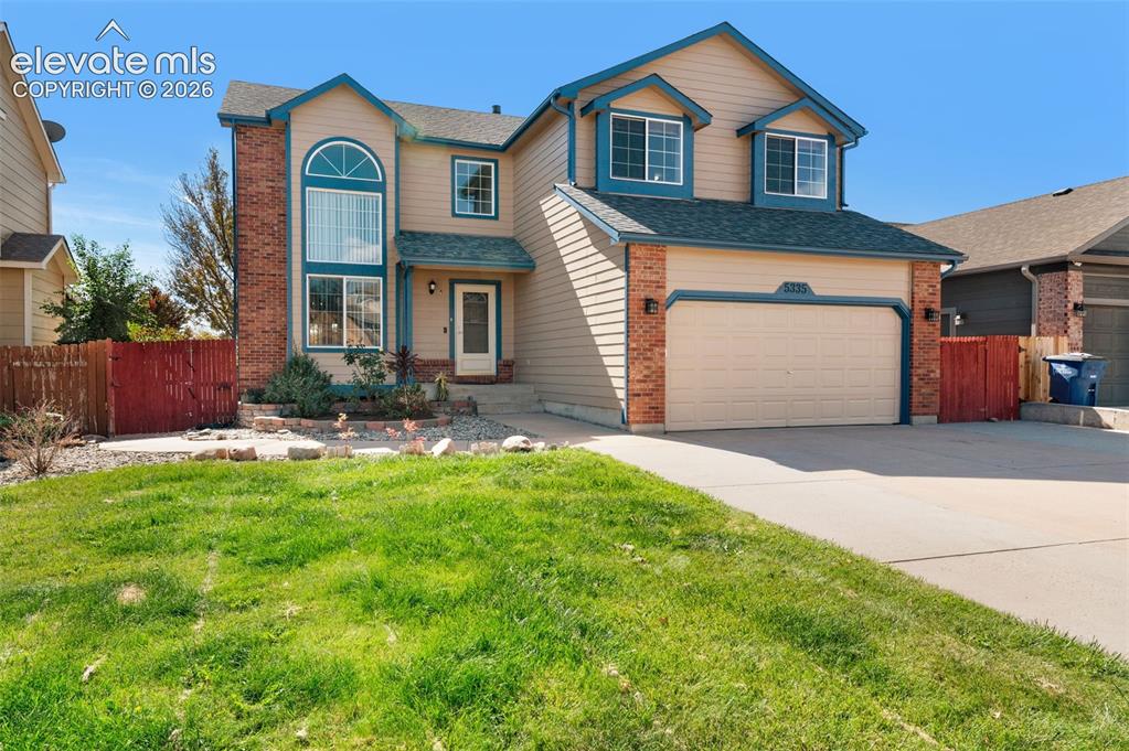 Image 1 of 48: Two-story exterior featuring brick and siding accents, an arched window, an