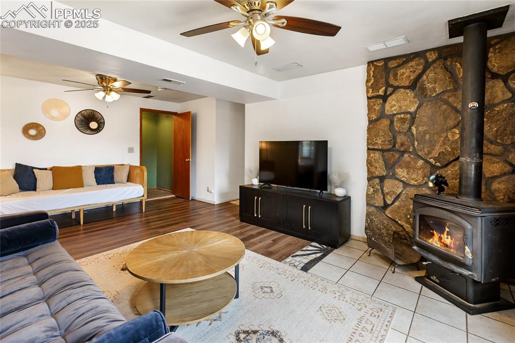 Image 29 of 50: Downstairs has large family room and walks out to the back.