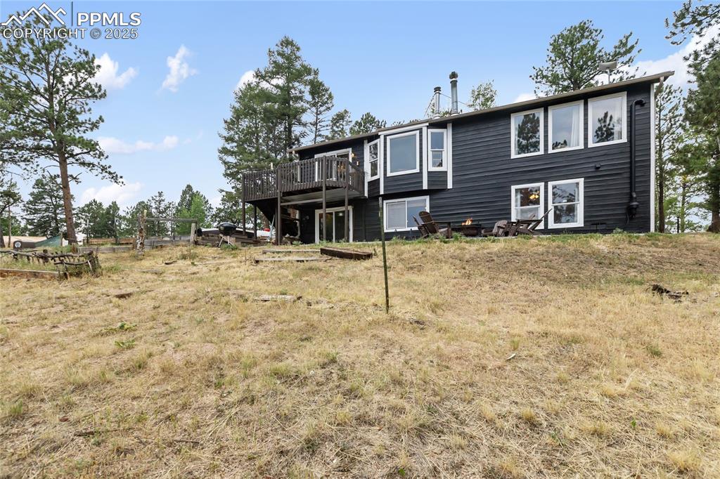 Image 9 of 50: Back of the house faces Pikes Peak.
