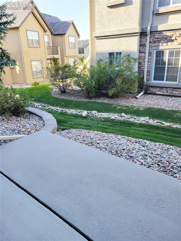 Image 20 of 38: Main level back patio.