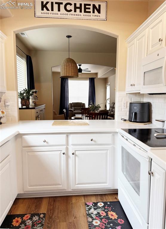 Image 4 of 38: Cute, bright and white kitchen!