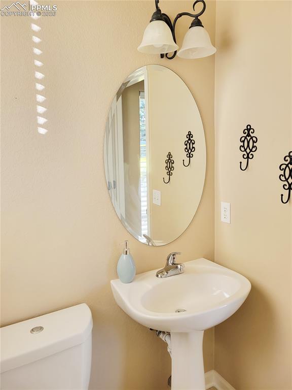 Image 7 of 38: Main level half bath