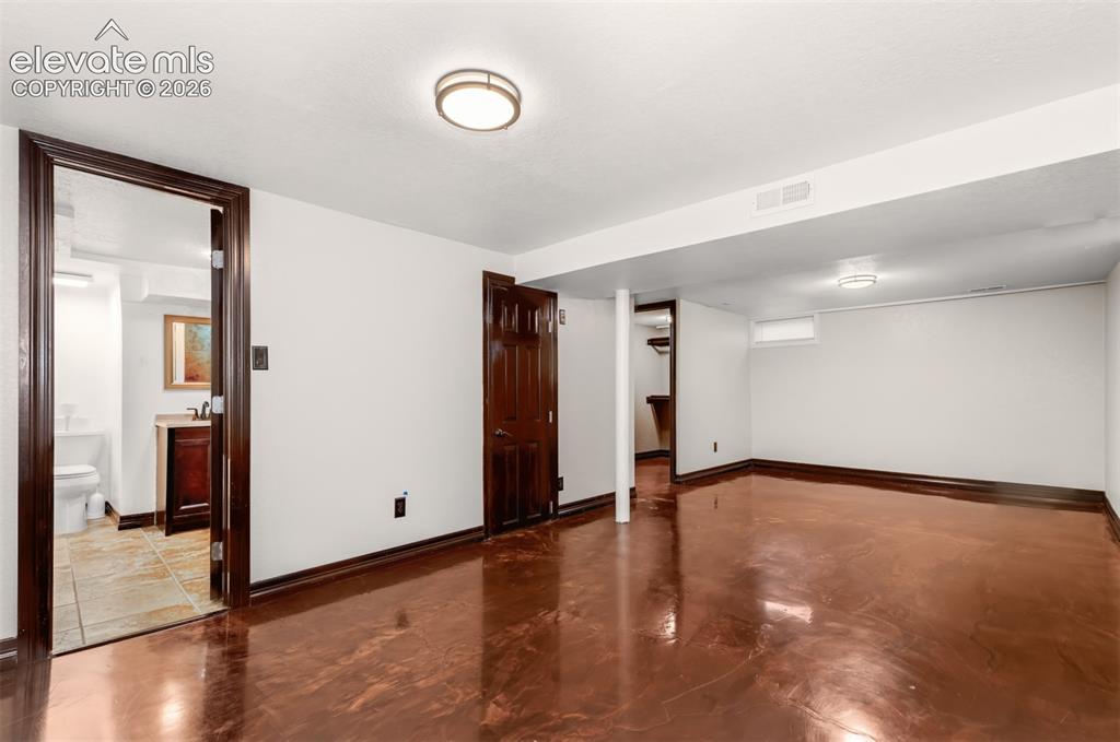 Image 24 of 36: Large basement bedroom. 