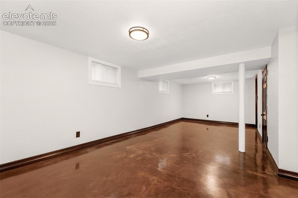 Image 25 of 36: Large basement bedroom.