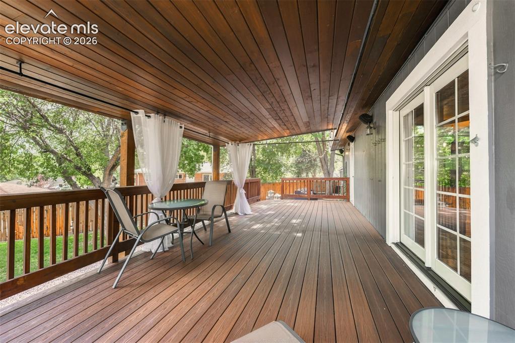Image 27 of 36: Large covered deck.