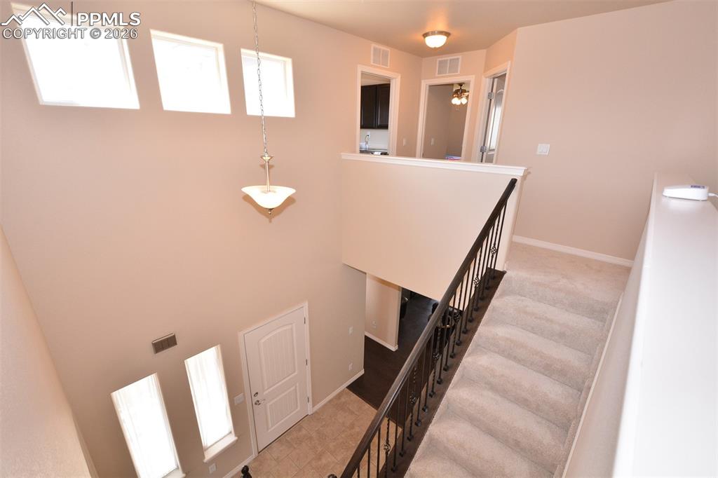 Image 13 of 30: Stairway to Upper level