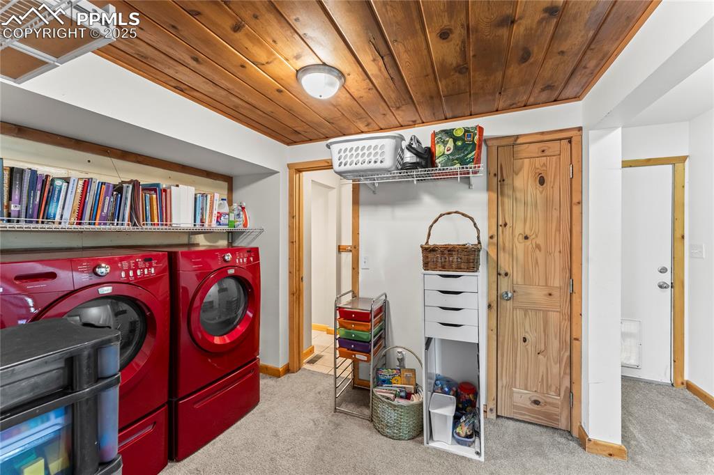 Image 17 of 30: Laundry area with door to side/back yard and closet