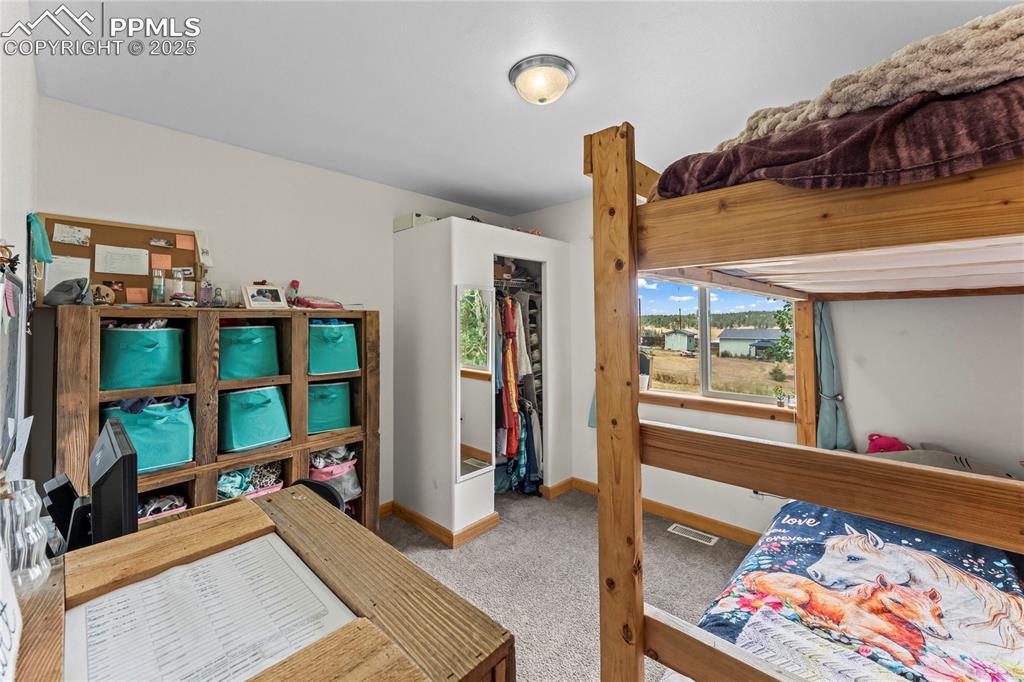 Image 23 of 30: Carpeted bedroom featuring baseboards and a closet