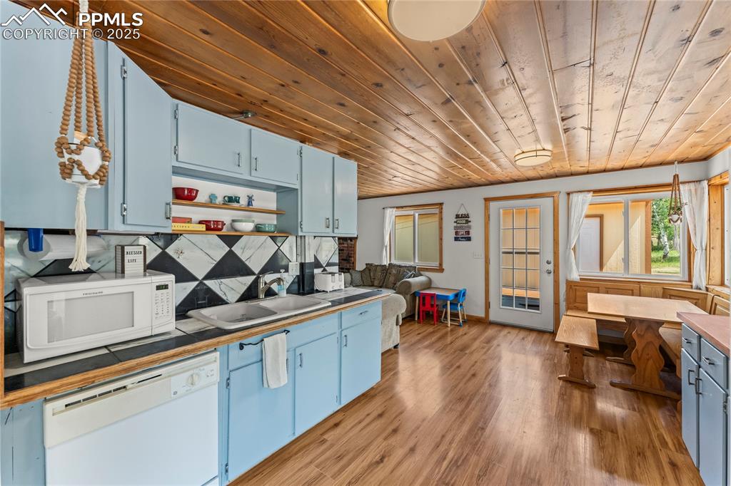 Image 8 of 30: Kitchen with wooden ceiling