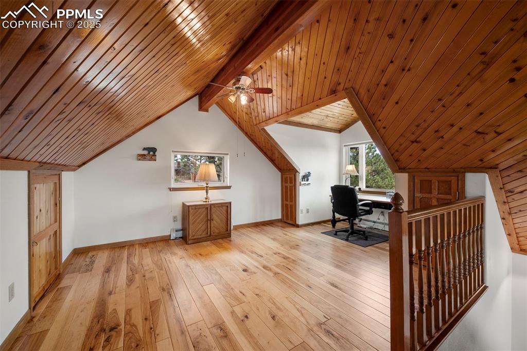 Image 15 of 38: Office area featuring light wood-type flooring and wood ceiling