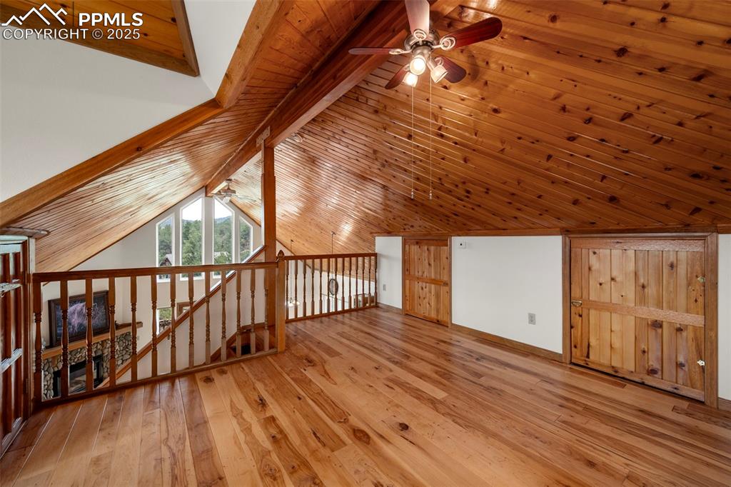 Image 16 of 38: Bonus room with light wood finished floors, ceiling fan, and wood ceiling