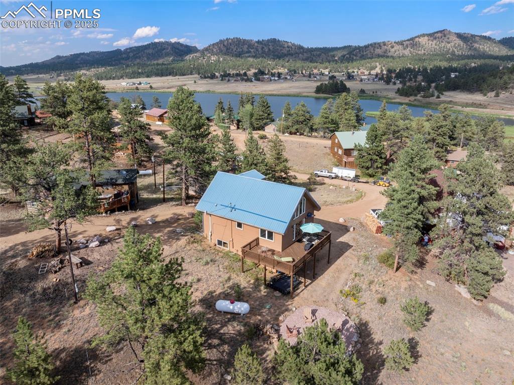 Image 3 of 38: View from above of property featuring a water and mountain view