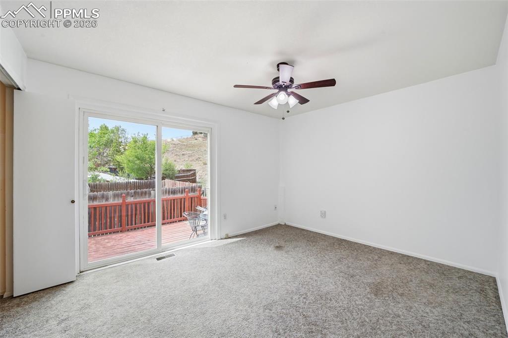 Image 22 of 36: Second bedroom, walk-out to your private back deck