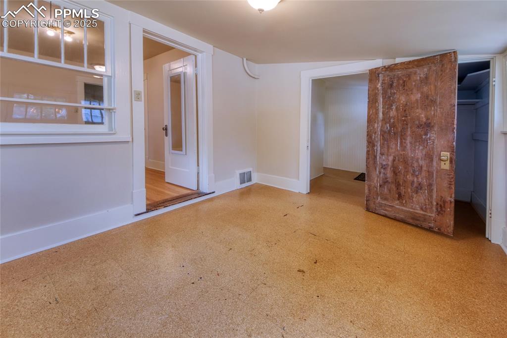 Image 19 of 28: Spare room featuring baseboards