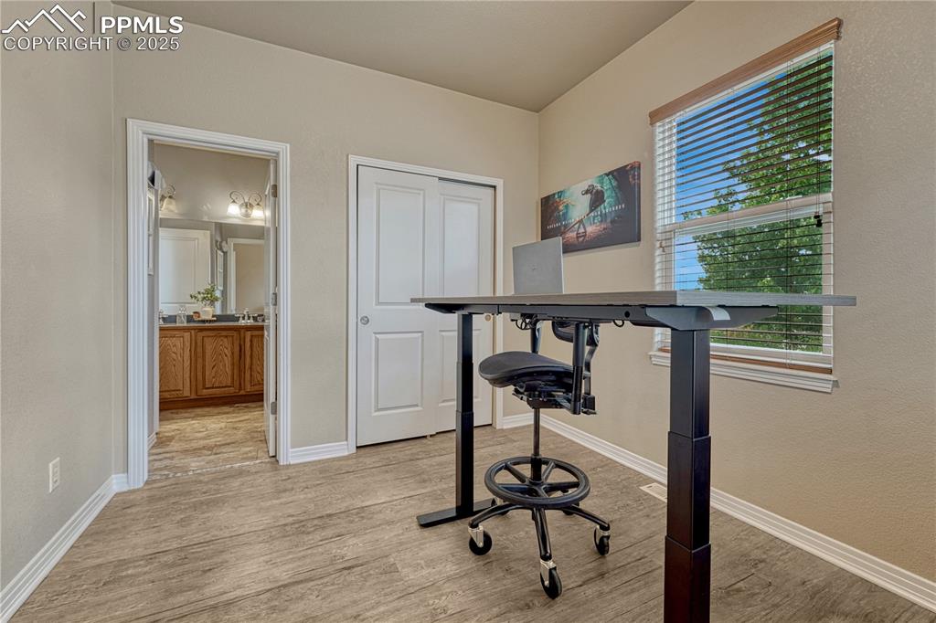 Image 19 of 47: Office area featuring light wood-style floors and baseboards