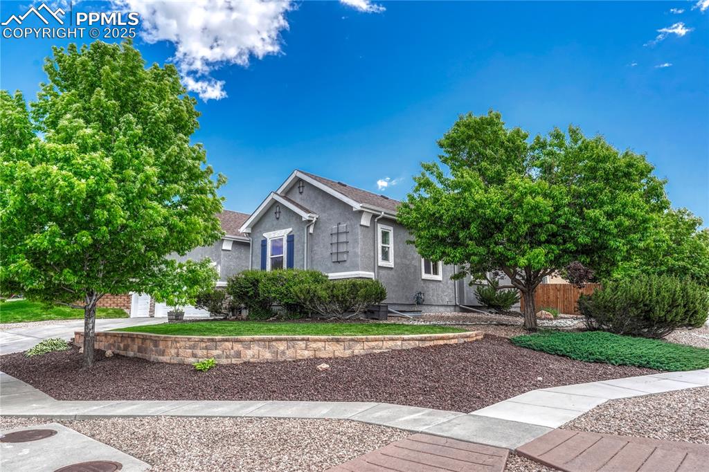 Image 7 of 47: View of front of house with stucco siding