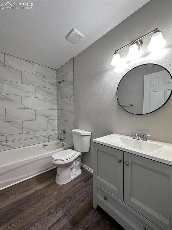 Image 13 of 23: Bathroom with vanity, shower / washtub combination, toilet, visible vents, 