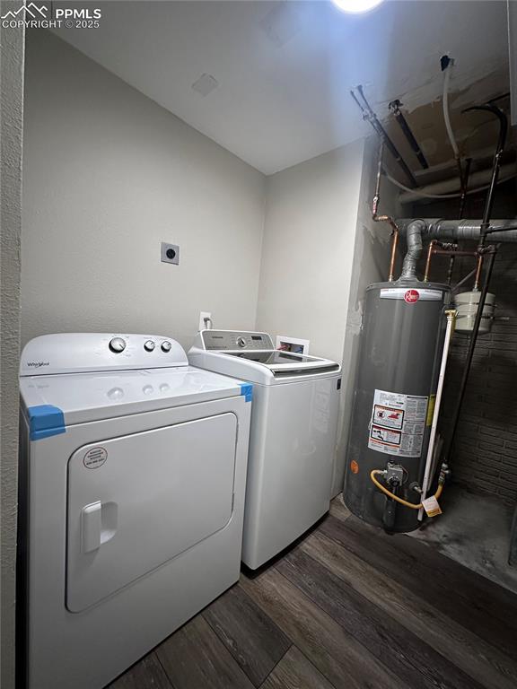 Image 20 of 23: Laundry room with washer and clothes dryer, laundry area, gas water heater,