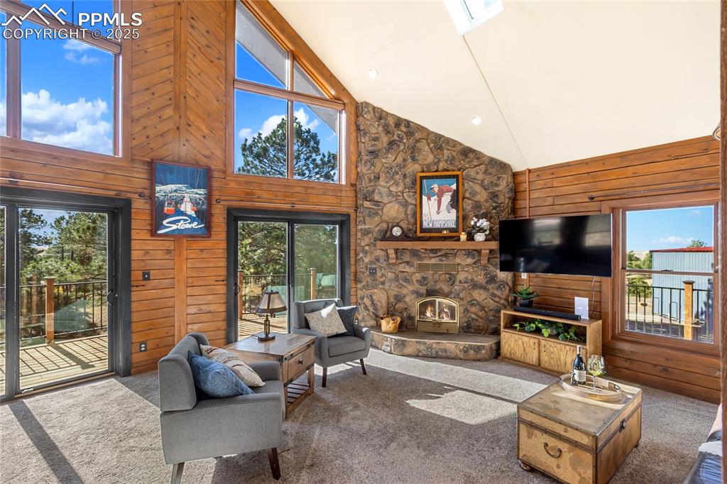 Image 16 of 50: Stunningly beautiful with huge windows, vaulted ceilings, and stone firepla