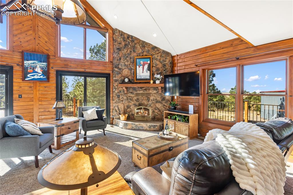 Image 19 of 50: Stunningly beautiful with huge windows, vaulted ceilings, and stone firepla