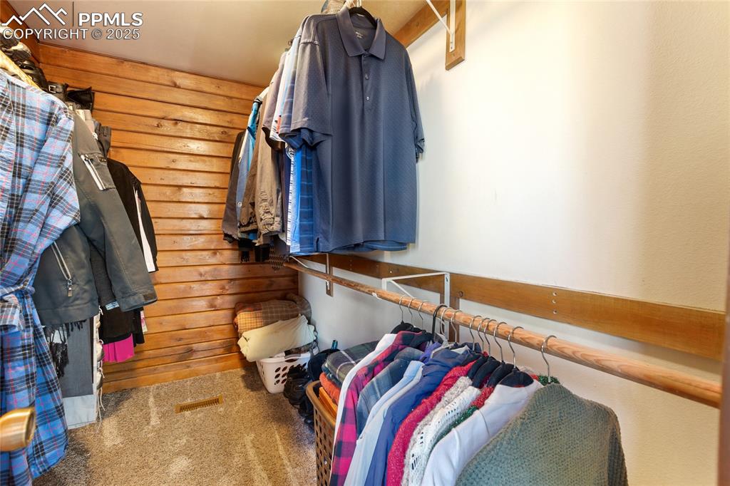 Image 29 of 50: Walk in closet