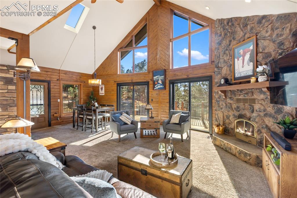 Image 4 of 50: Stunningly beautiful with huge windows, vaulted ceilings, and stone firepla