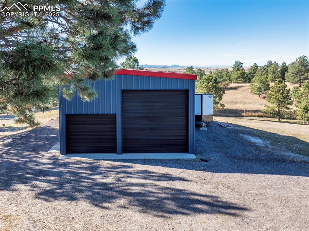 Image 47 of 50: Huge garage with workshop, and rv parking