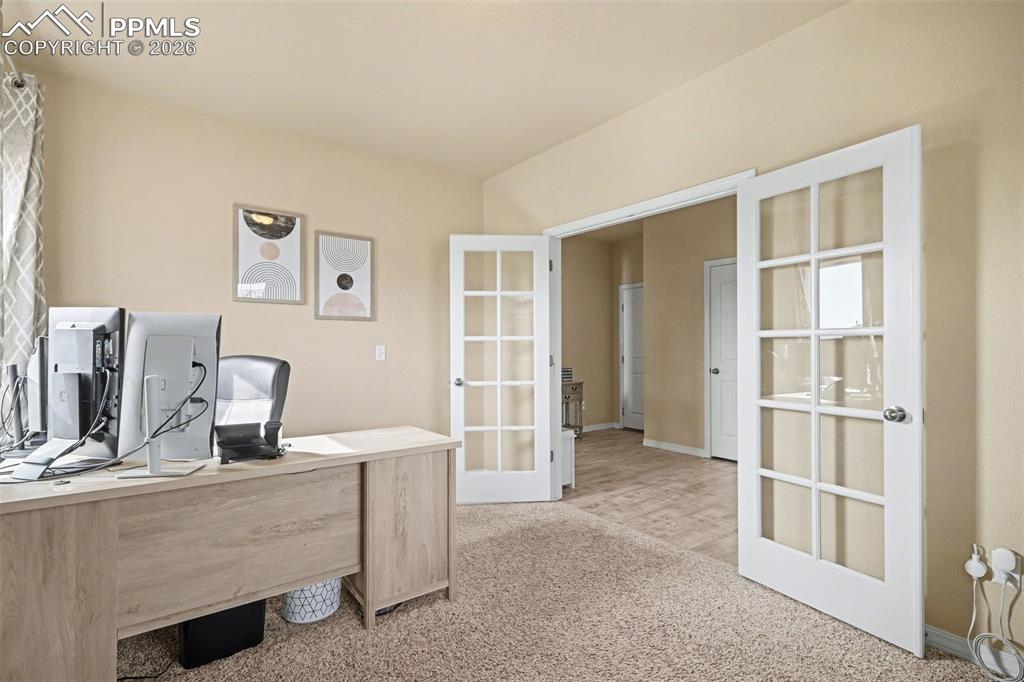 Image 19 of 40: Interior room featuring neutral-toned walls and carpet flooring