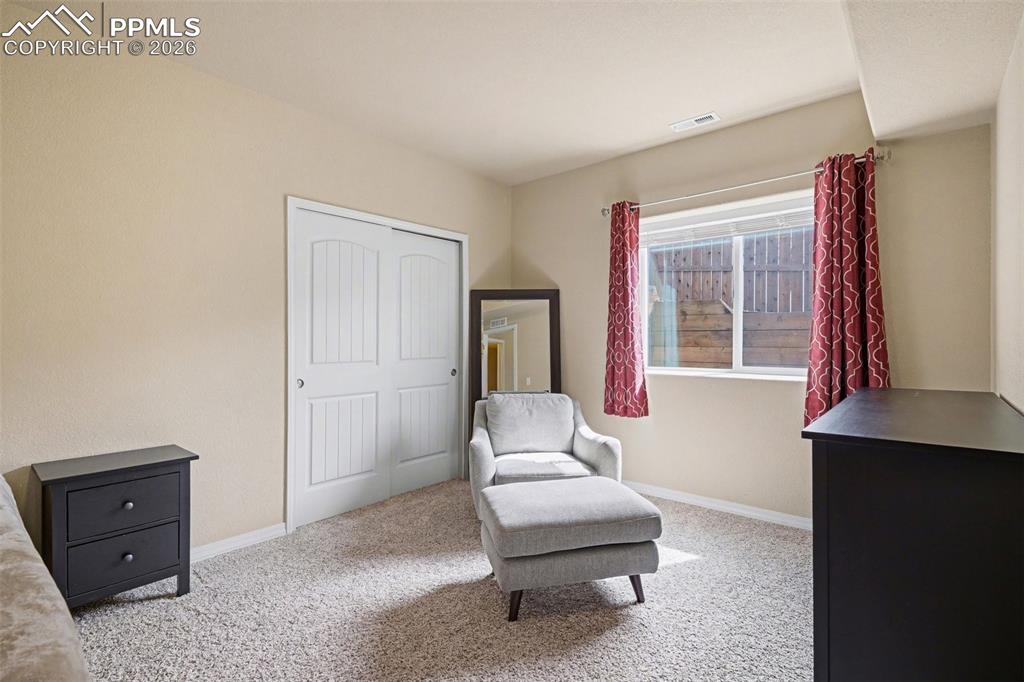 Image 21 of 40: Carpeted room featuring a double-door closet, a single window, and neutral 