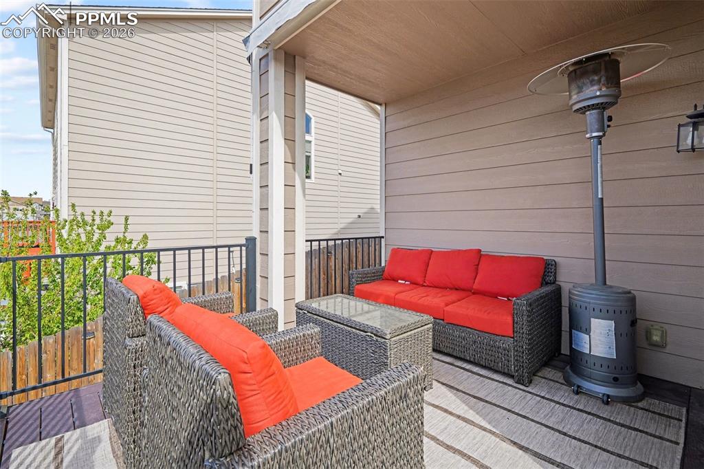 Image 37 of 40: Covered patio featuring a solid ceiling and durable flooring
