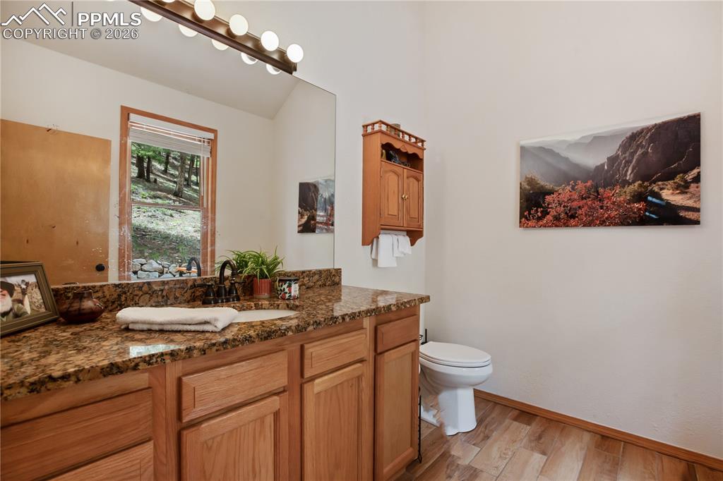 Image 13 of 34: Main level half bath for guests
