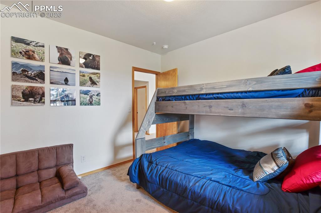 Image 20 of 34: One of two bedrooms on the lower level