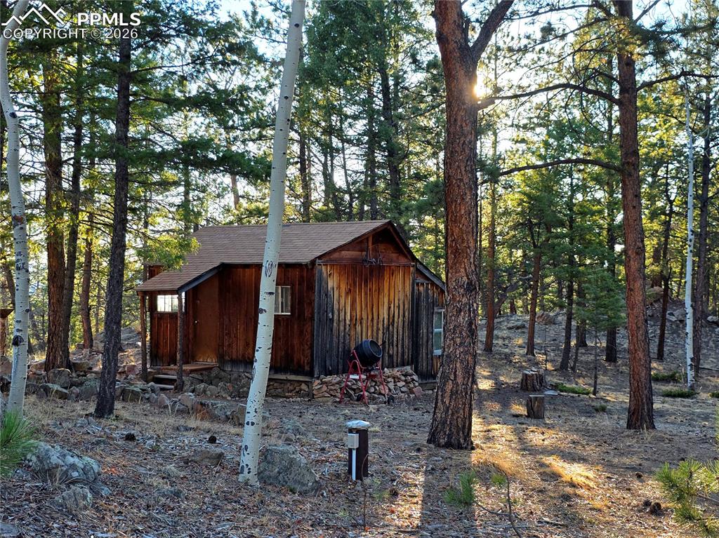 Image 28 of 33: original bunkhouse with so much charm and potential