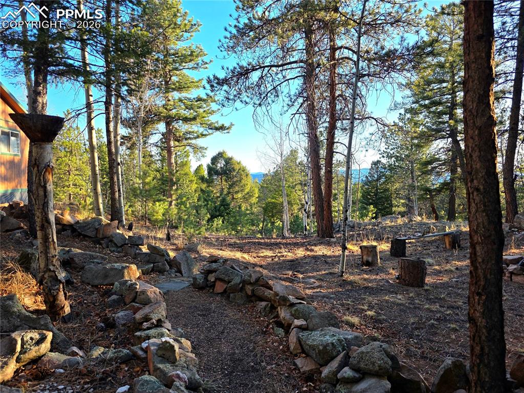 Image 37 of 49: pathway from original bunkhouse to main home