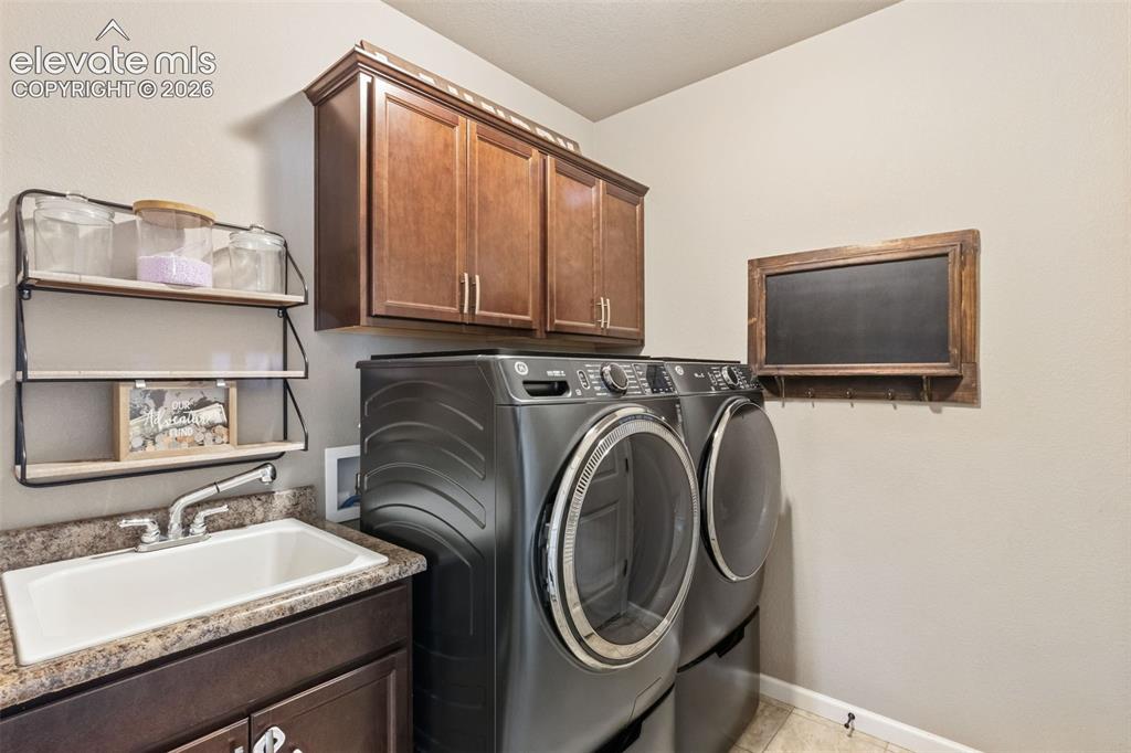 Image 19 of 40: laundry room off garage entry. (Washer and dryer do not stay with property)