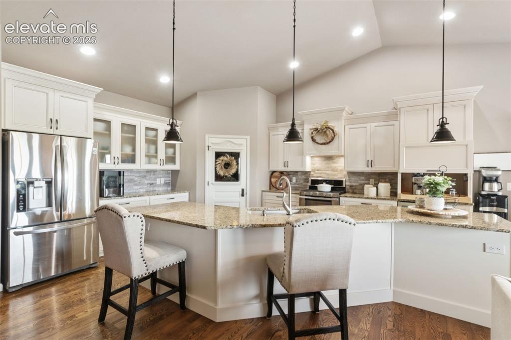Image 5 of 40: Gorgeous thoughtfully upgraded kitchen with walkout