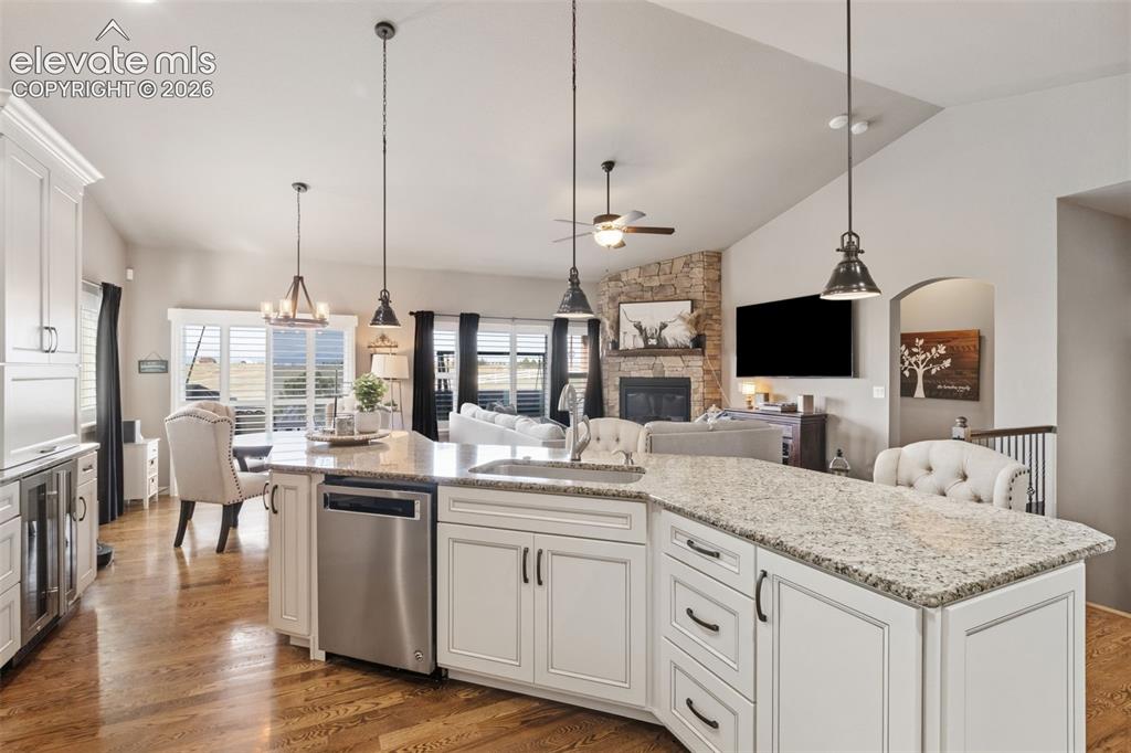 Image 7 of 40: Gorgeous thoughtfully upgraded kitchen with walkout