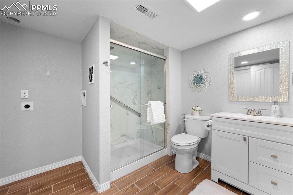 Image 23 of 34: Basement bathroom with laundry hook-up