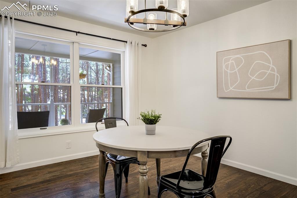 Image 15 of 50: Formal Dining room with views out the large windows