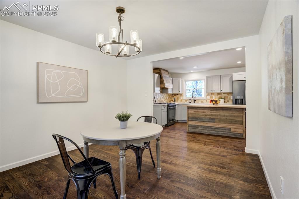 Image 16 of 50: Formal Dining Room off the kitchen