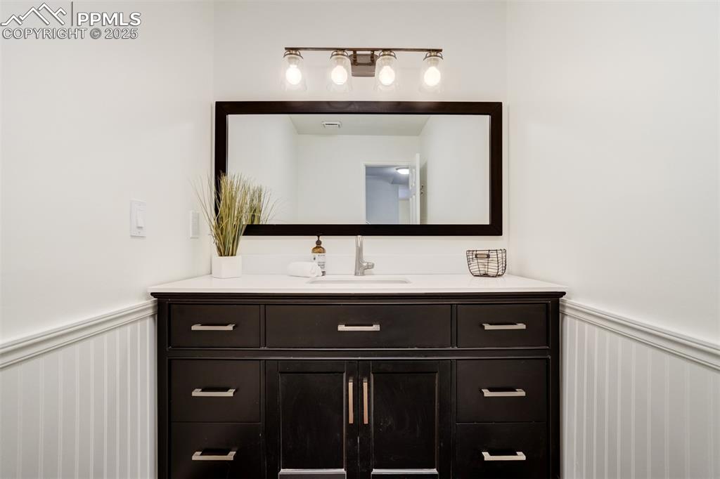 Image 19 of 50: Main level half bathroom