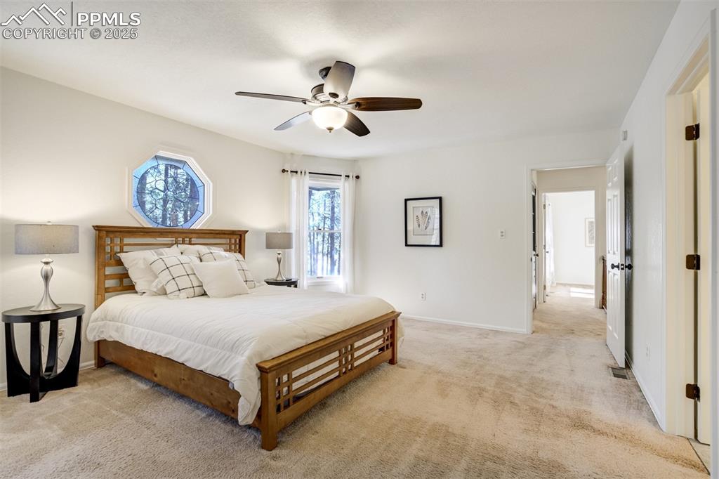 Image 21 of 50: Primary Bedroom with private bath and a balcony outside the door!