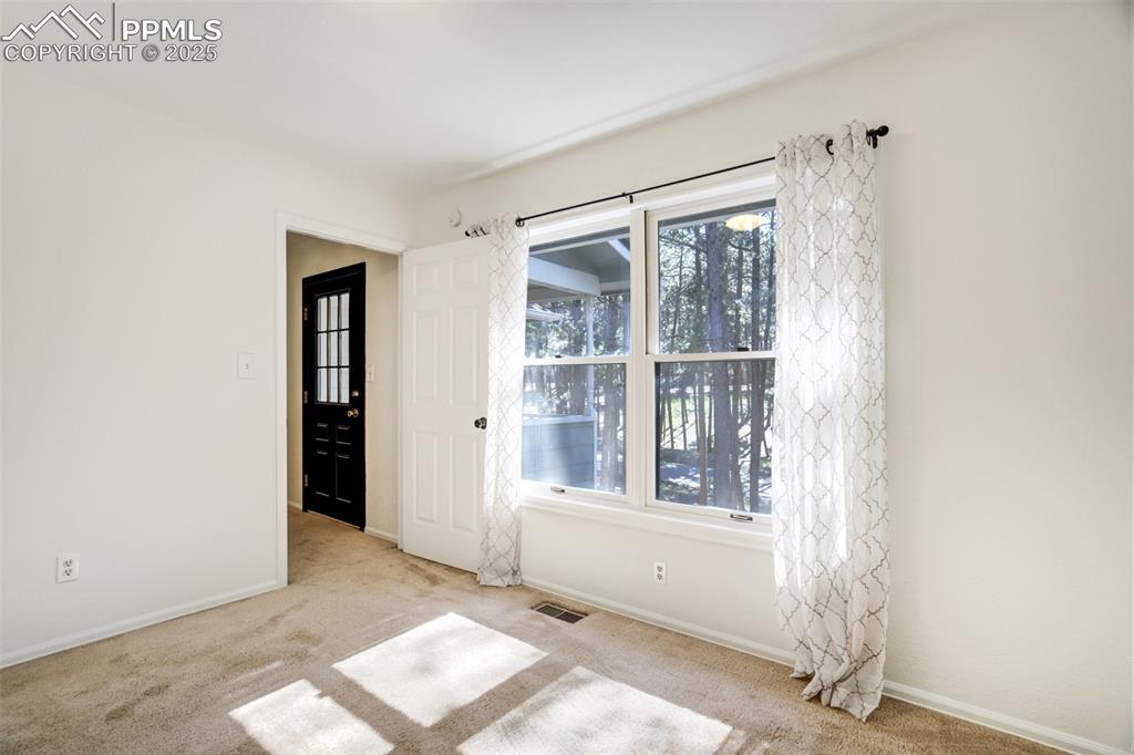 Image 29 of 50: The 4th upstairs bedroom and the door that leads to upper balcony