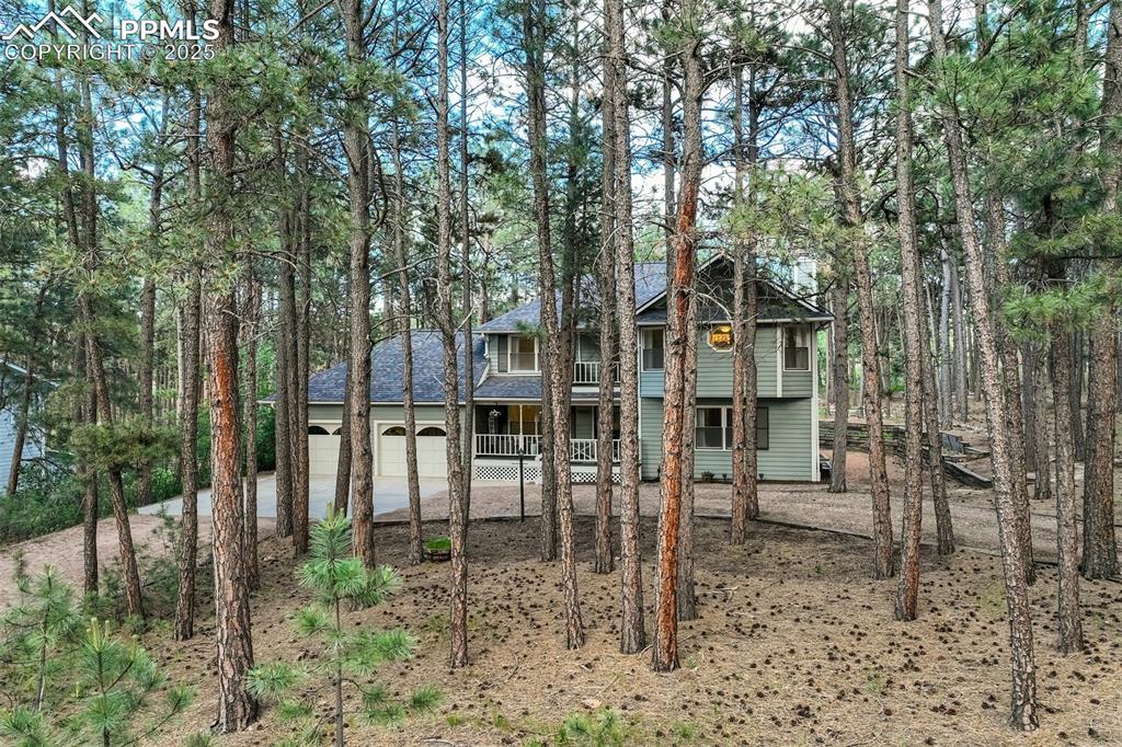 Image 3 of 50: Imagine being tucked away in the trees yet close to amenities