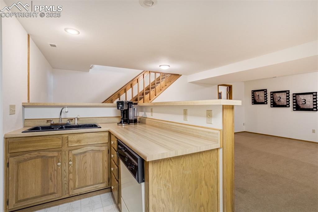Image 35 of 50: Complete with a dishwasher, oven, refrigerator, and cook top!