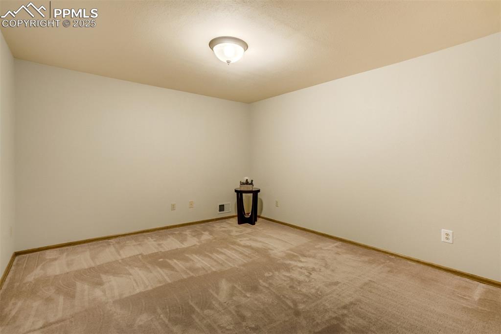 Image 37 of 50: 5th bedroom in basement serves as a Junior suite - complete with a separate