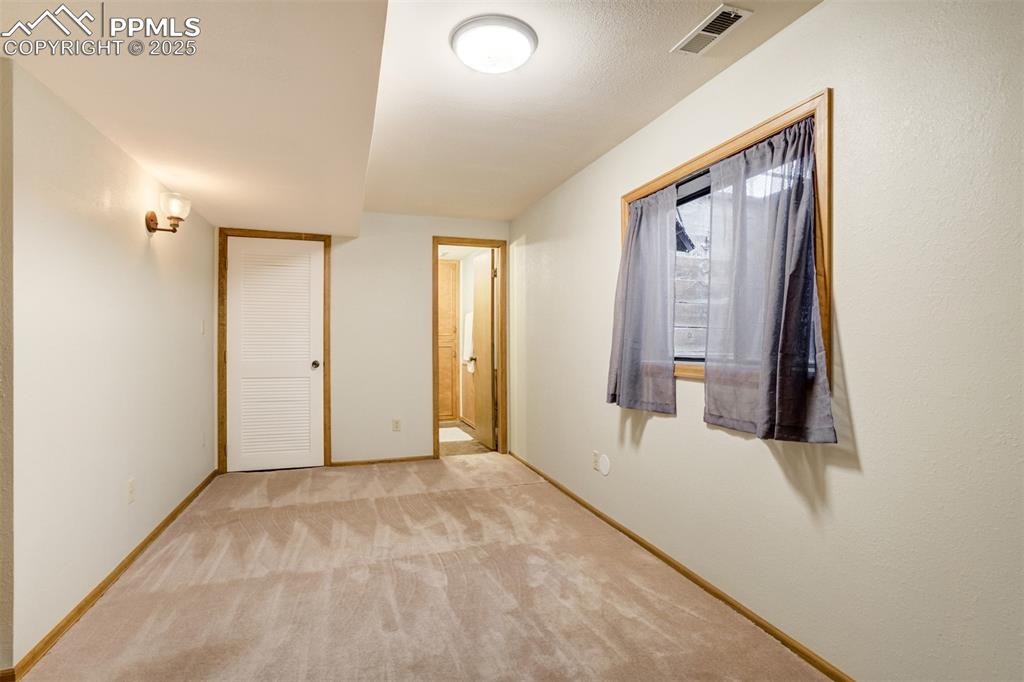 Image 39 of 50: sitting room adjacent to the basement bedroom and bathroom 